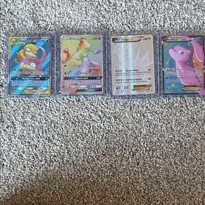 4 pokemon cards. Two GX and two EX